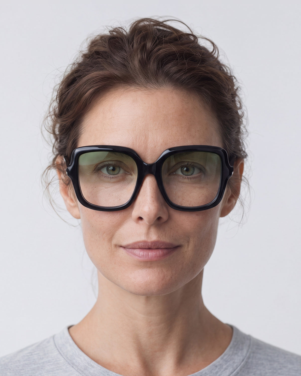 Elara in black, worn, Sage lenses